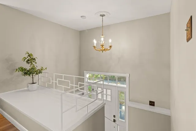 a dining room with table & chairs