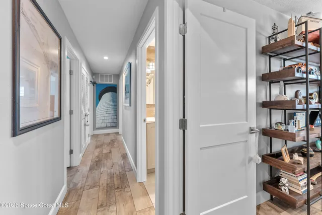 a bedroom with a bed and a book shelf