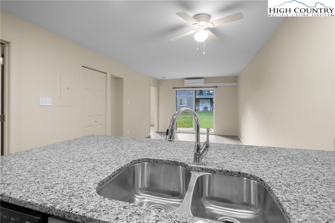 128 Zeb Street, Unit A101 Boone, NC 28607 - Photo 11 of 32 a kitchen with a sink and a counter top space