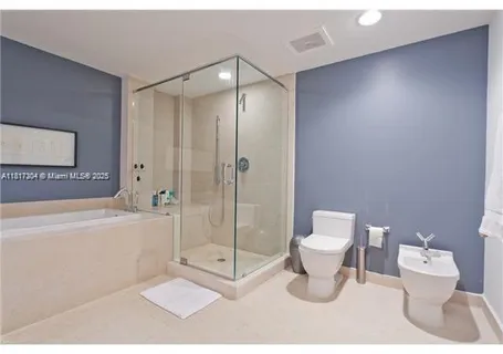 a bathroom with a toilet a sink and bathtub