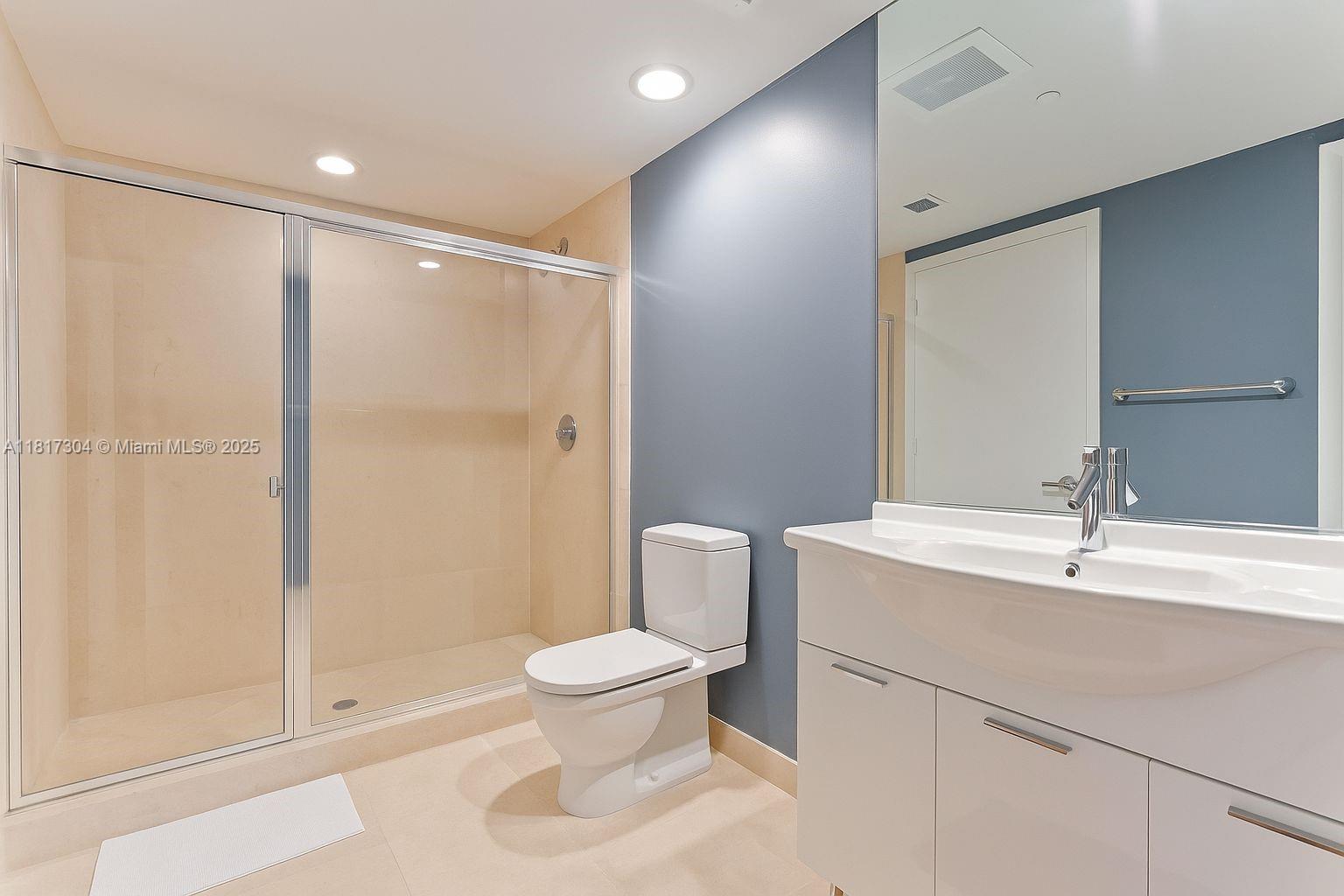 495 Brickell Avenue, Unit 5104 Miami, FL 33131 - Photo 16 of 21 a bathroom with a sink toilet and shower
