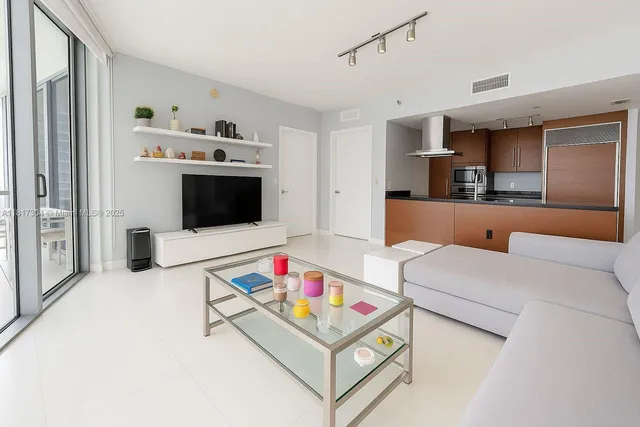 a living room with furniture and flat screen tv