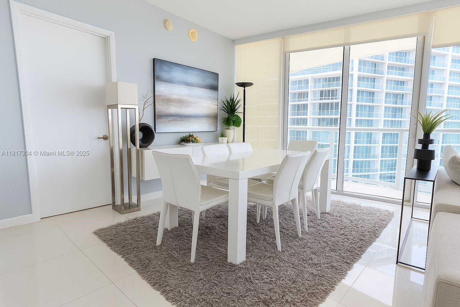 495 Brickell Avenue, Unit 5104 Miami, FL 33131 - Photo 5 of 21 a dining room with furniture and window