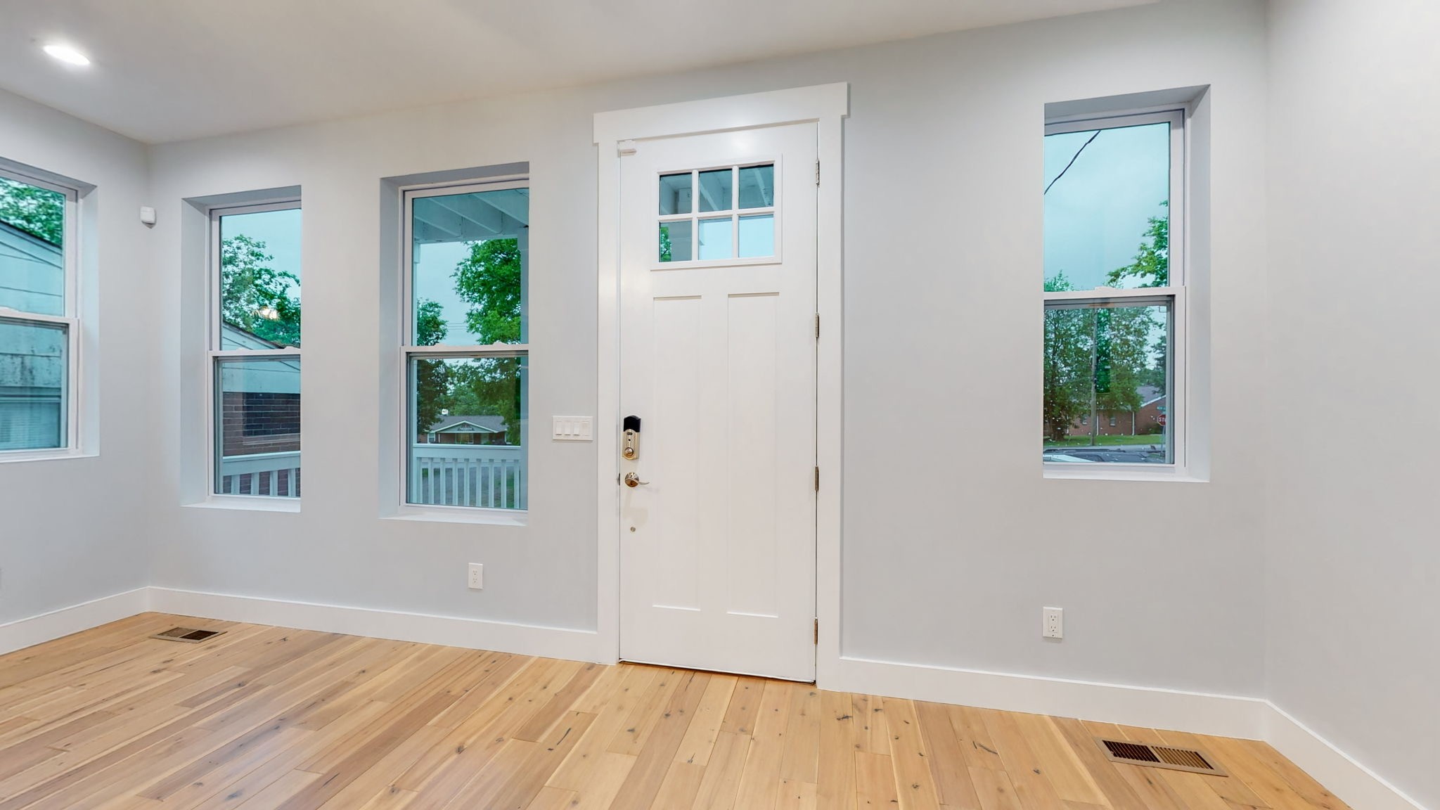 128 Ben Allen Road Nashville, TN 37207 - Photo 11 of 51 an empty room with wooden floor and windows