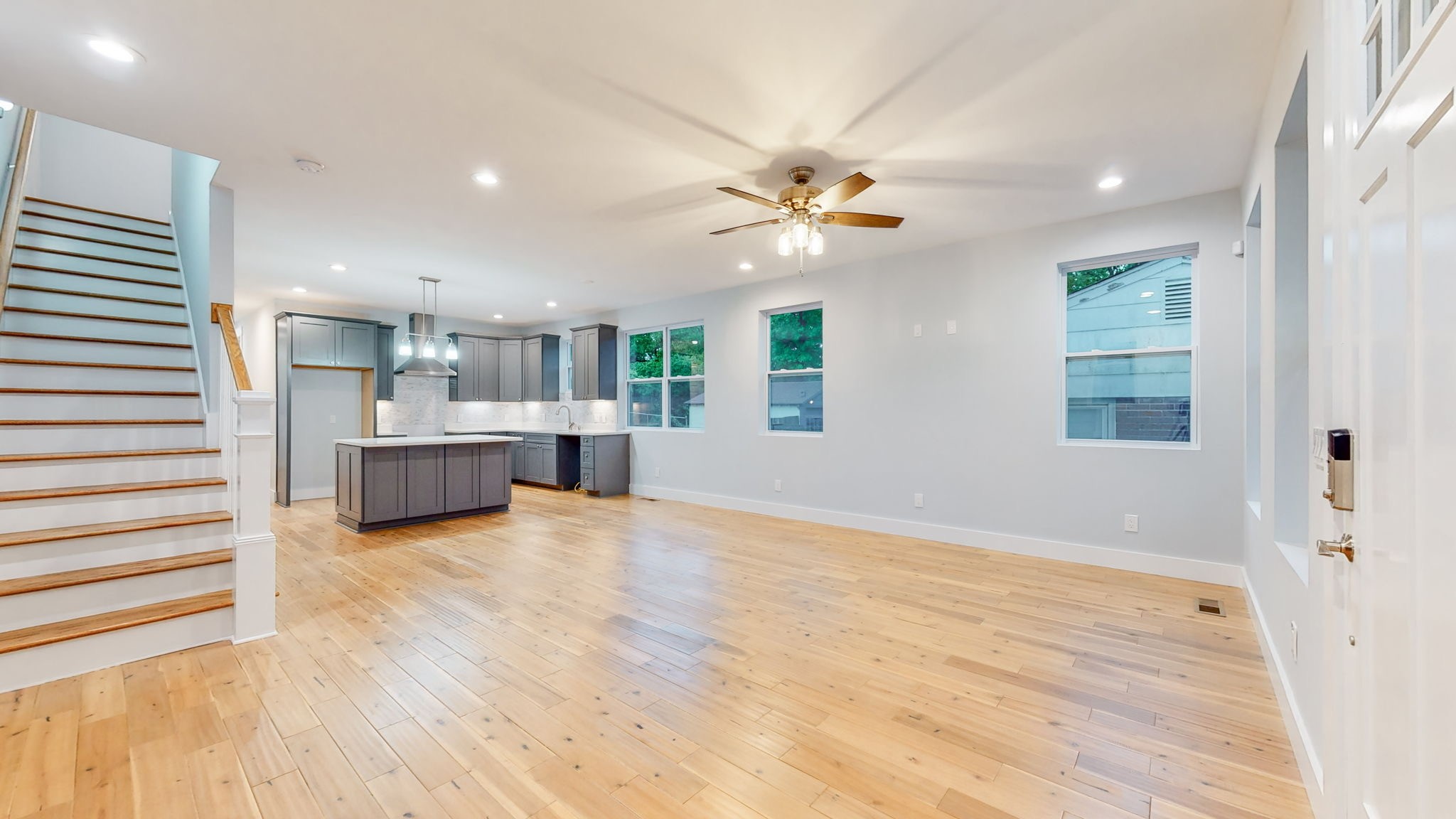 128 Ben Allen Road Nashville, TN 37207 - Photo 12 of 51 a view of a big room with wooden floor and a kitchen