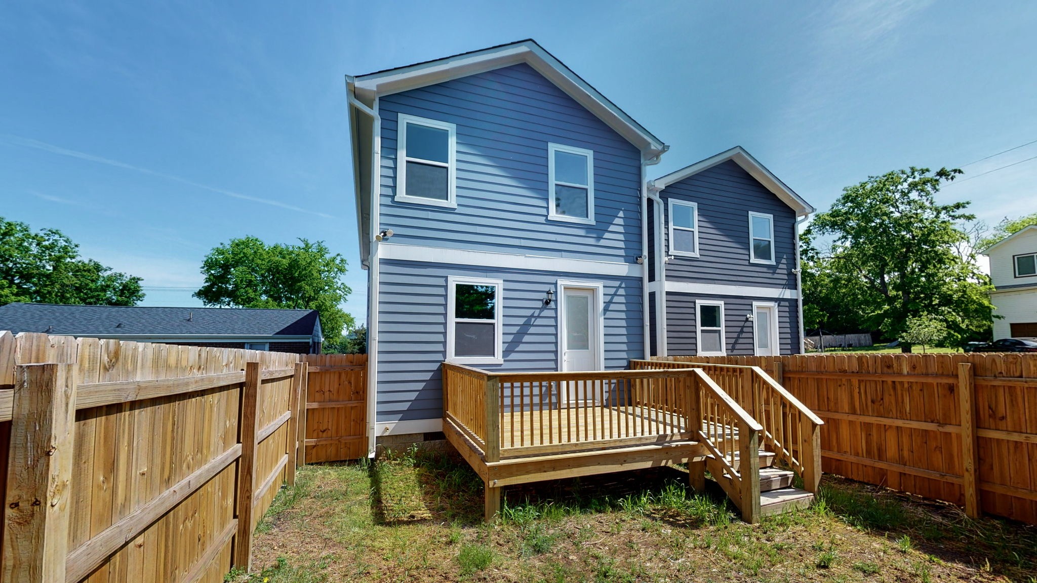 128 Ben Allen Road Nashville, TN 37207 - Photo 45 of 51 a view of a house with a wooden deck and furniture