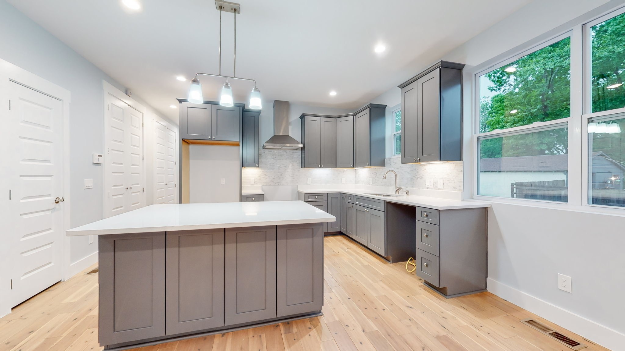 128 Ben Allen Road Nashville, TN 37207 - Photo 8 of 51 a large kitchen with kitchen island a large island in it