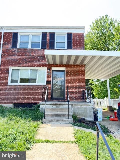 6226 Robin Hill Road Baltimore, MD 21207 - Photo 2 of 2 a front view of a house with garden