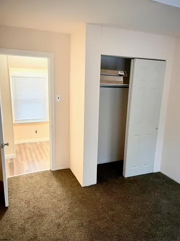 a view of empty room with closet