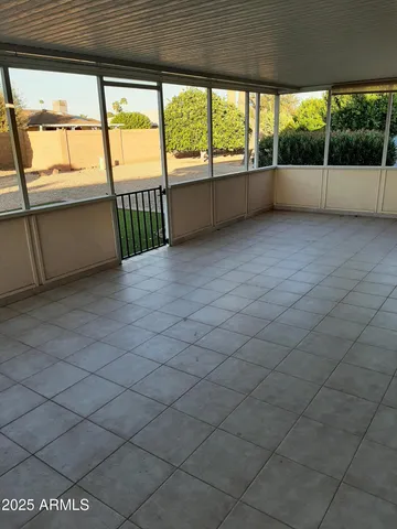 a view of an empty room with a large window