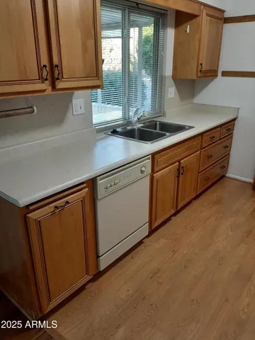 a kitchen with stainless steel appliances granite countertop a sink and a cabinets