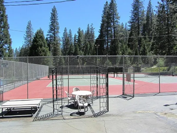 a view of a park with iron fence