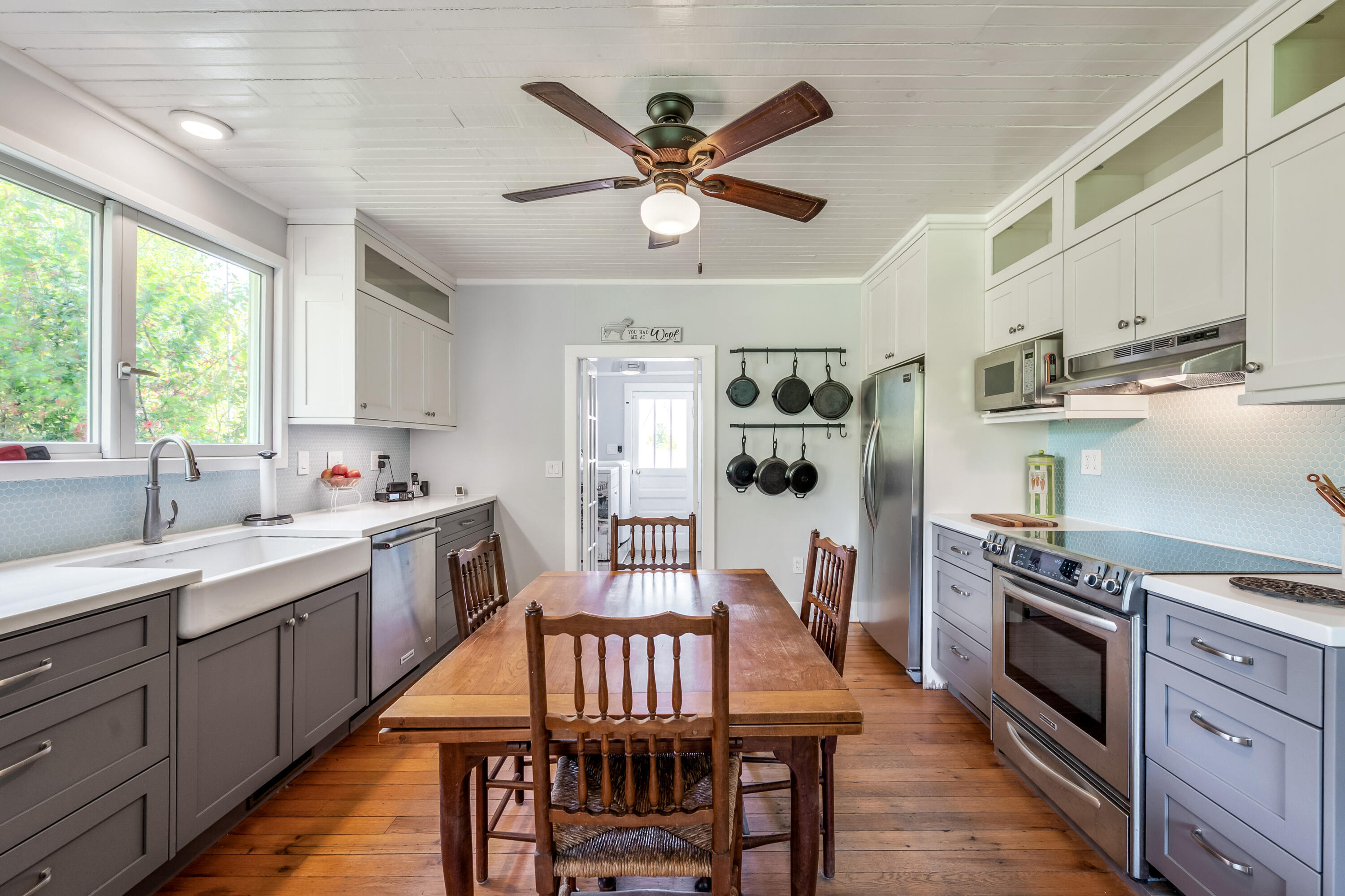 771 White Oak Grove Road Northeast Riner, VA 24149 - Photo 16 of 113 a kitchen with stainless steel appliances granite countertop a stove a sink dishwasher a dining table and chairs with wooden floor