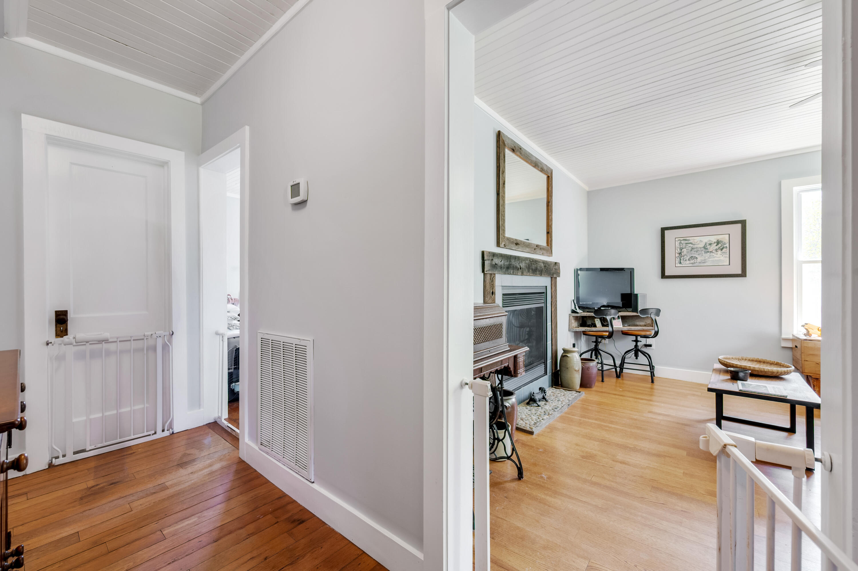 771 White Oak Grove Road Northeast Riner, VA 24149 - Photo 23 of 113 a view of a livingroom with wooden floor and a workspace