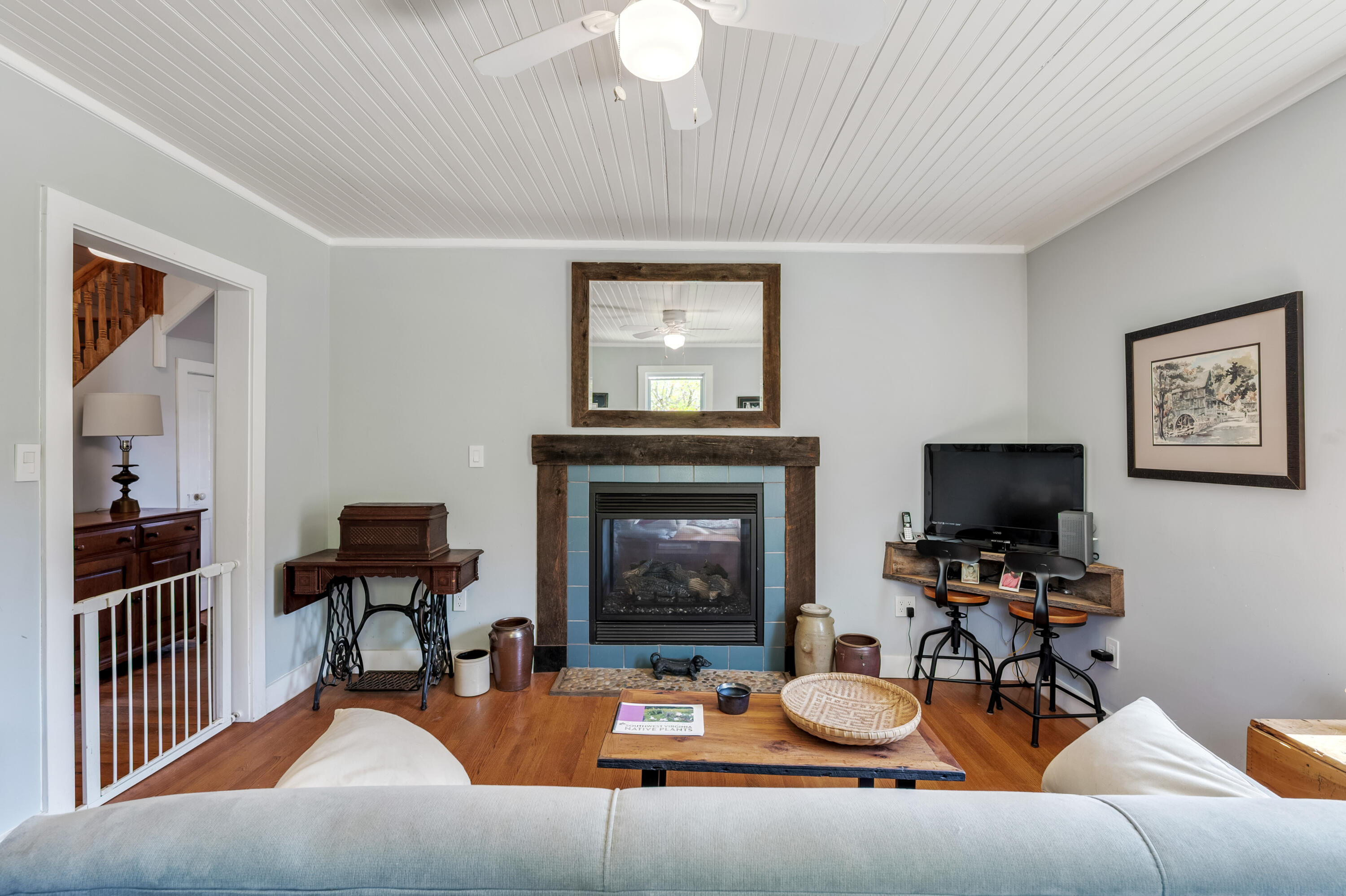 771 White Oak Grove Road Northeast Riner, VA 24149 - Photo 27 of 113 a living room with furniture a fireplace and a flat screen tv