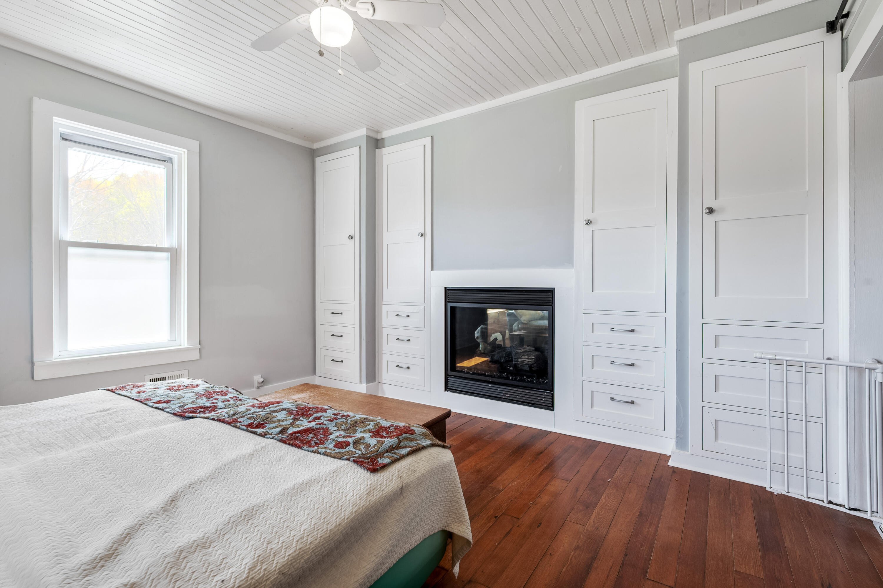 771 White Oak Grove Road Northeast Riner, VA 24149 - Photo 29 of 113 a bedroom with a bed and a fireplace