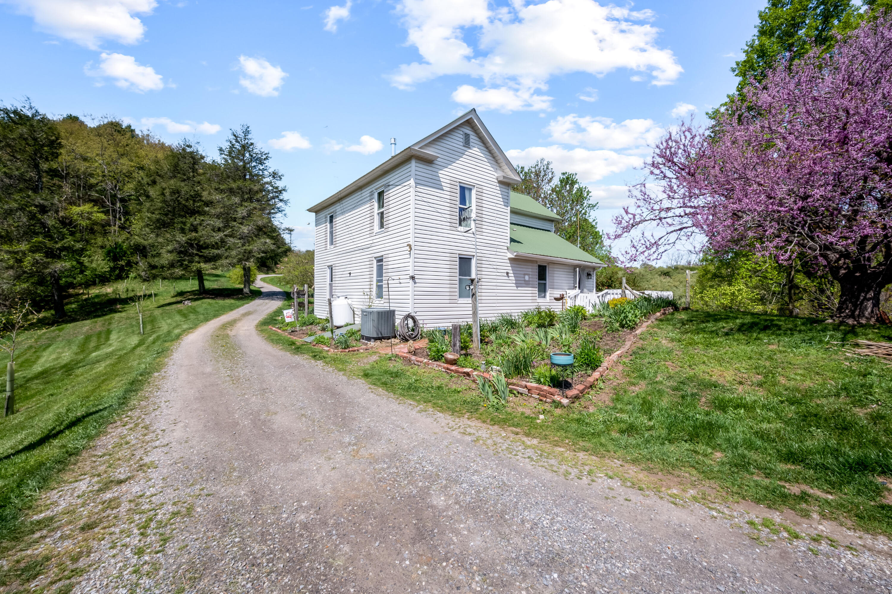 771 White Oak Grove Road Northeast Riner, VA 24149 - Photo 3 of 113 a front view of a house with a yard and pathway