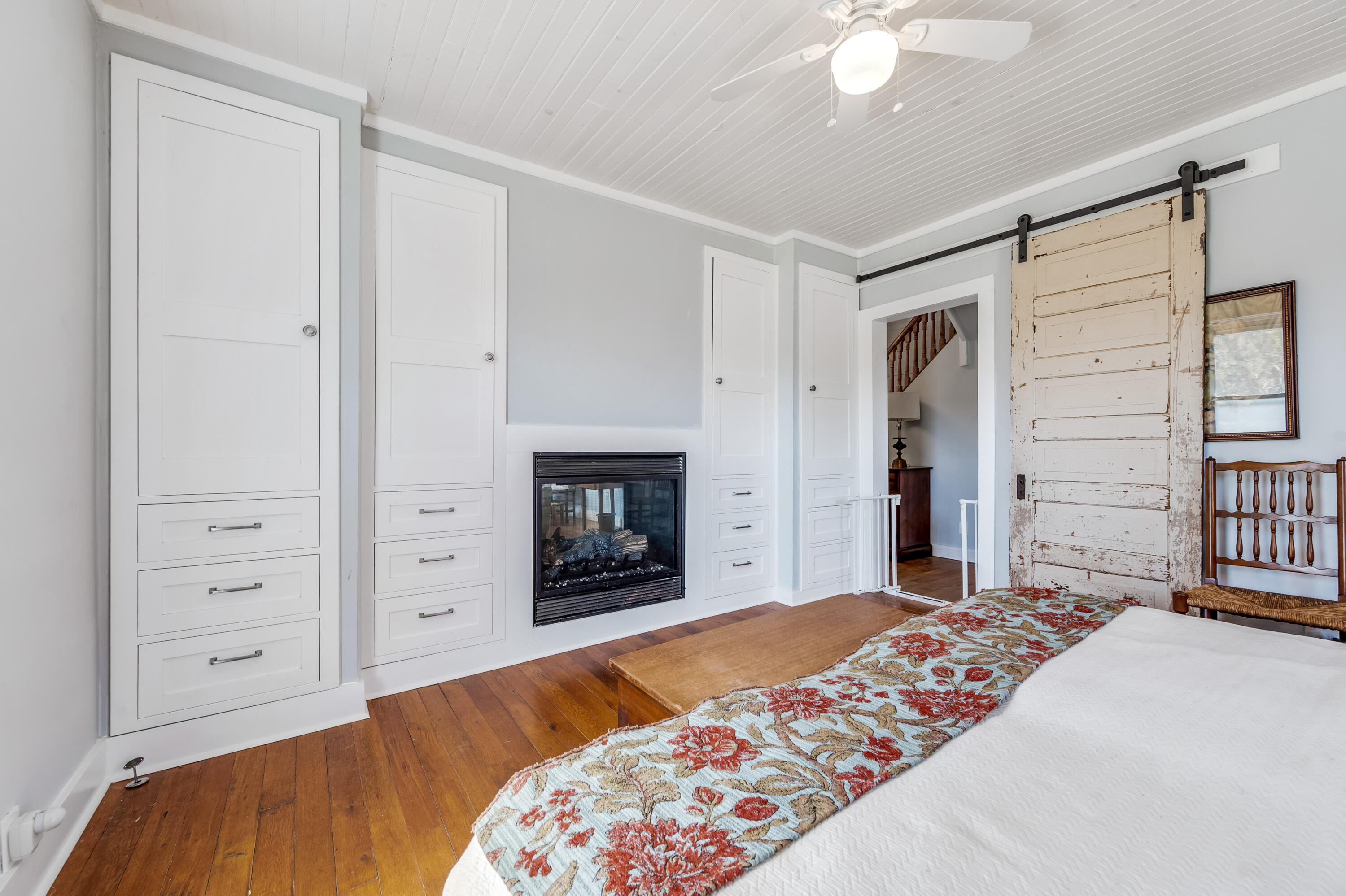 771 White Oak Grove Road Northeast Riner, VA 24149 - Photo 31 of 113 a bedroom with a bed and a chandelier