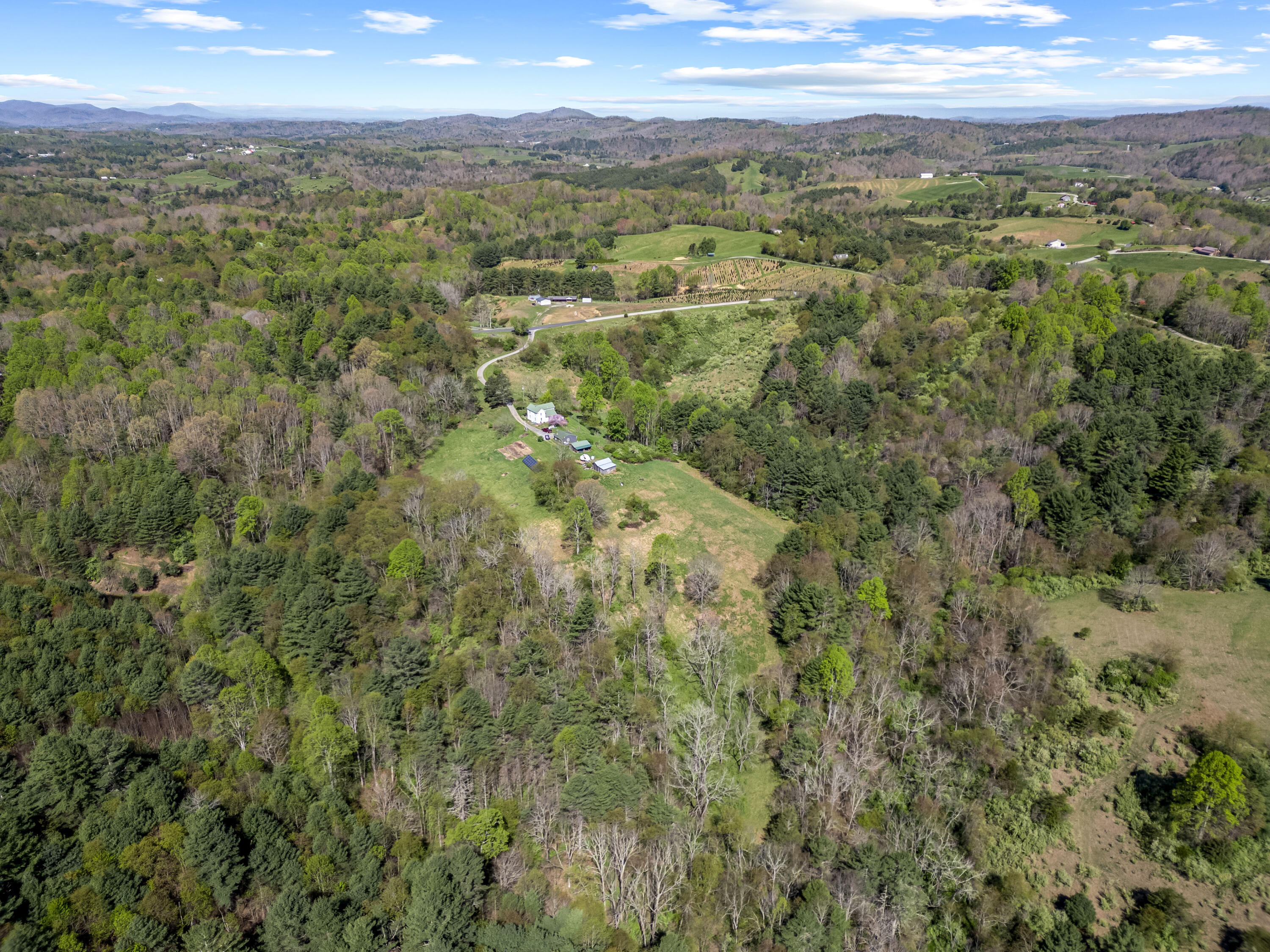771 White Oak Grove Road Northeast Riner, VA 24149 - Photo 98 of 113 a view of a city with lush green forest