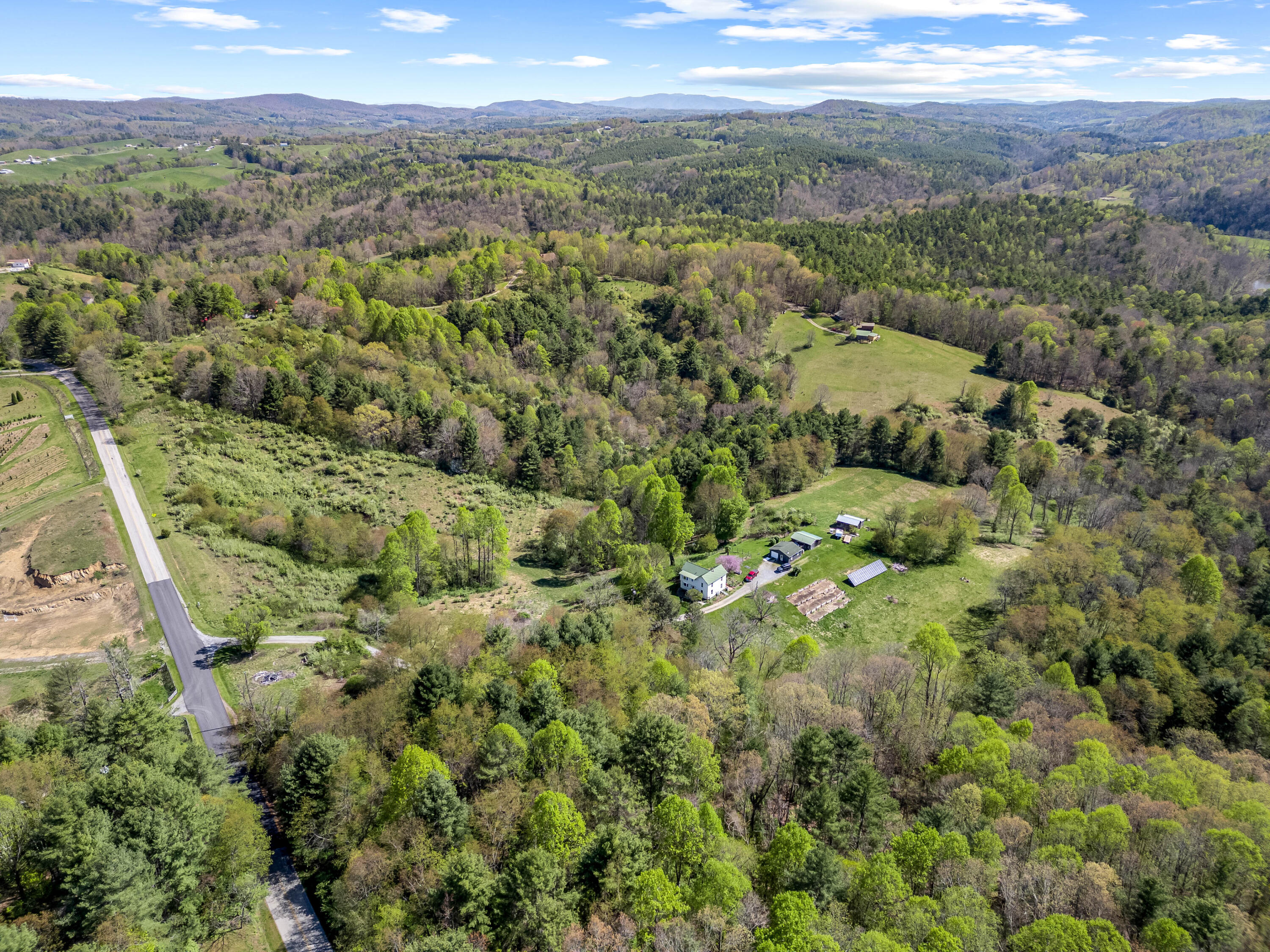 771 White Oak Grove Road Northeast Riner, VA 24149 - Photo 99 of 113 a view of a city with green field