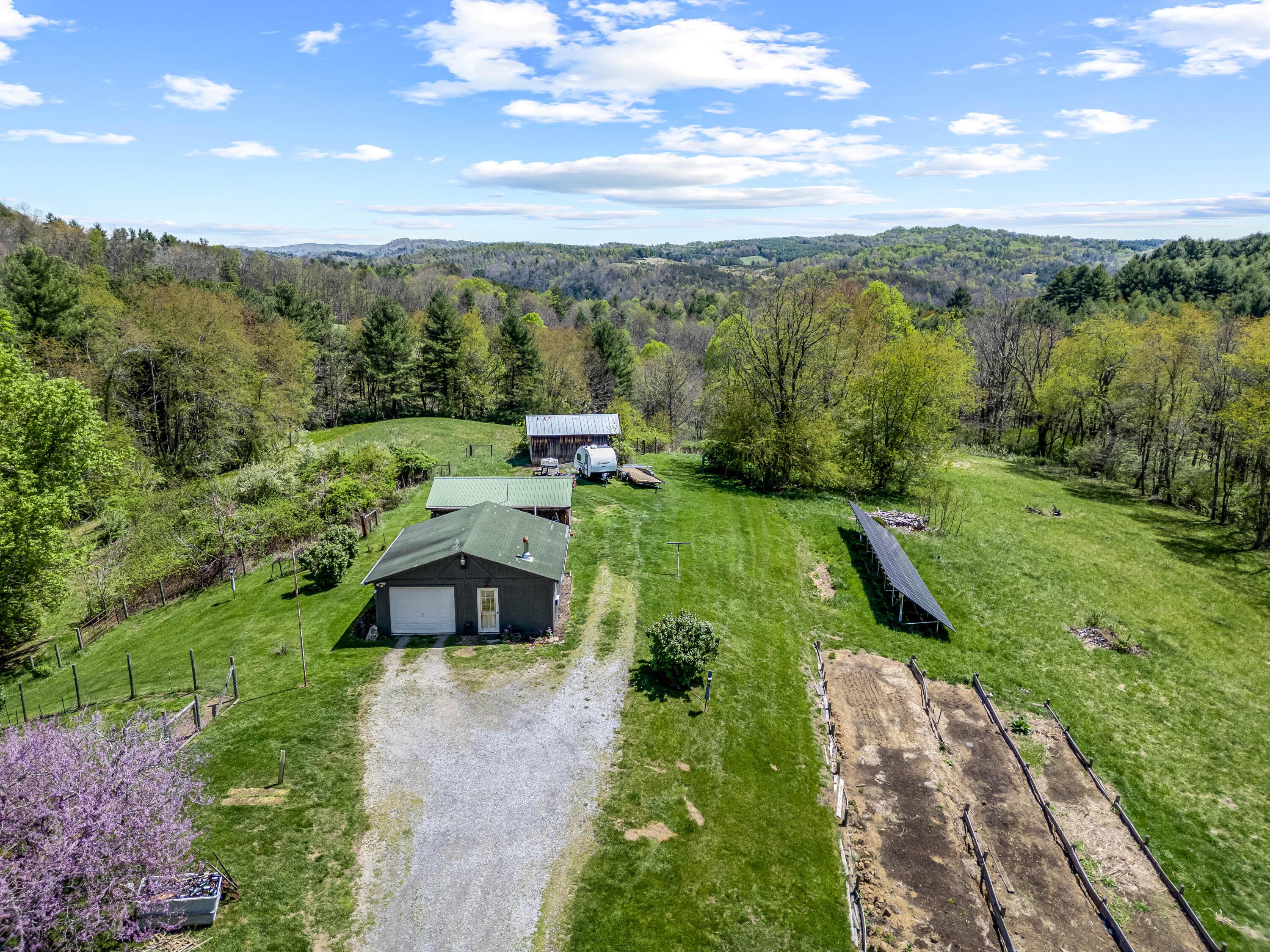 771 White Oak Grove Road Northeast Riner, VA 24149 - Photo 100 of 113 a view of a city with lush green forest
