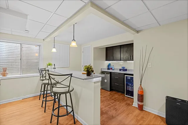 a view of a livingroom with furniture window and wooden floor