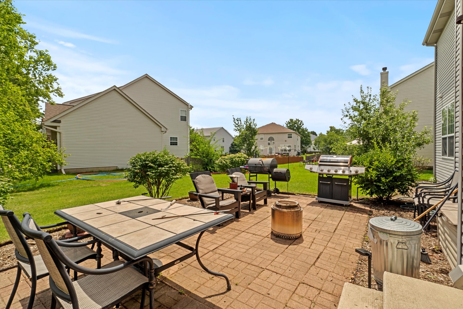 1314 Danhof Drive Bolingbrook, IL 60490 - Photo 30 of 39 a view of a patio with table and chairs and potted plants