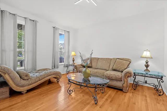 a living room with furniture and a lamp