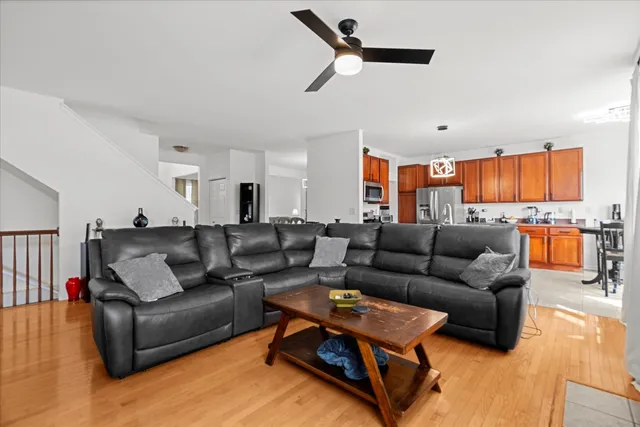 a living room with furniture and kitchen view