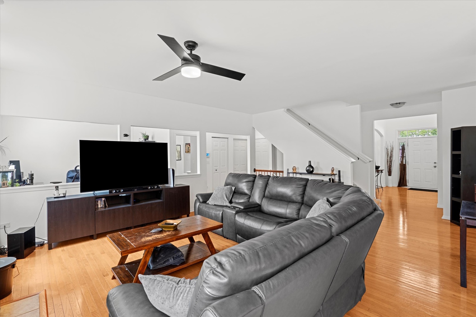 1314 Danhof Drive Bolingbrook, IL 60490 - Photo 10 of 39 a living room with furniture and a flat screen tv