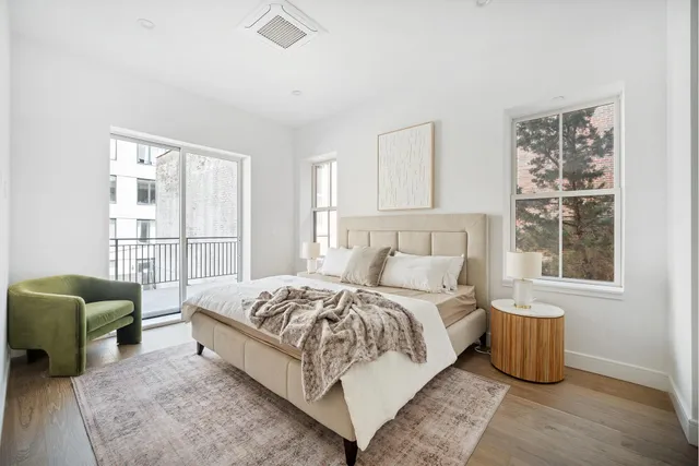 a kitchen with stainless steel appliances granite countertop a sink a stove and refrigerator