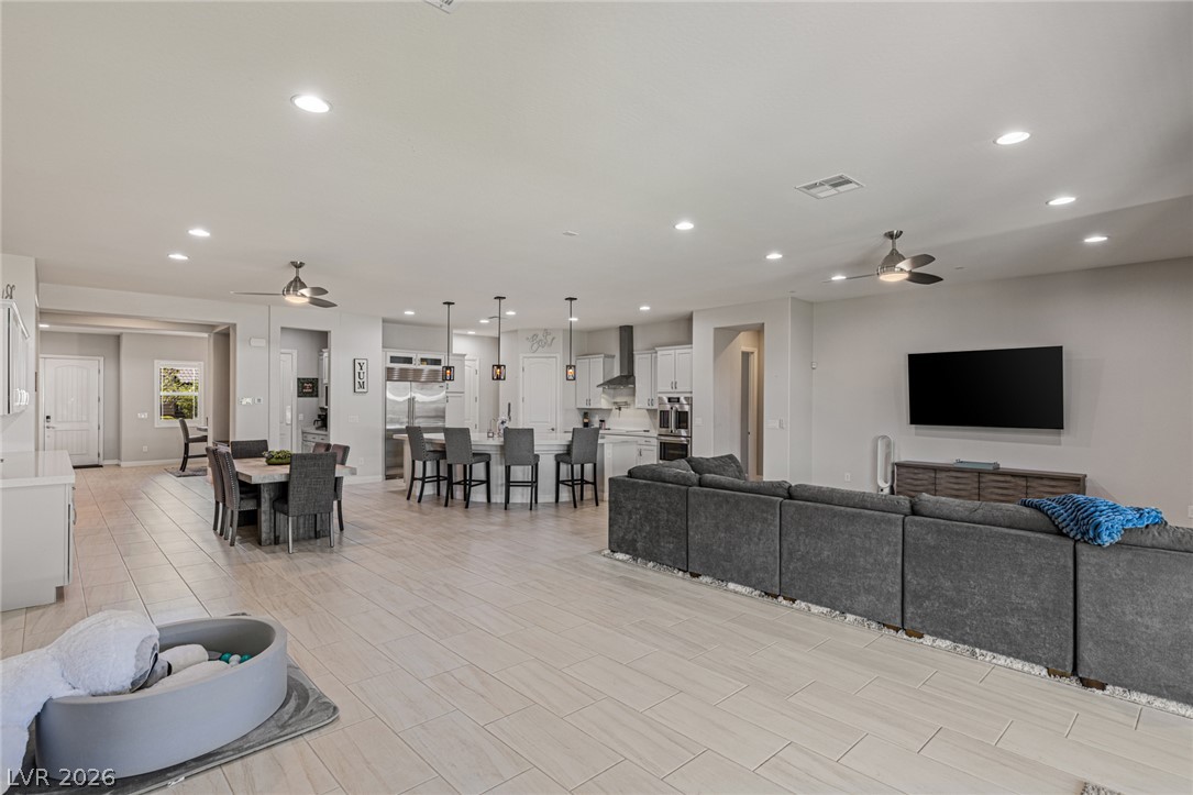 7036 Arabian Ridge Street Las Vegas, NV 89131 - Photo 18 of 64 Large great room area perfect for entertaining flows seamlessly from the kitchen.