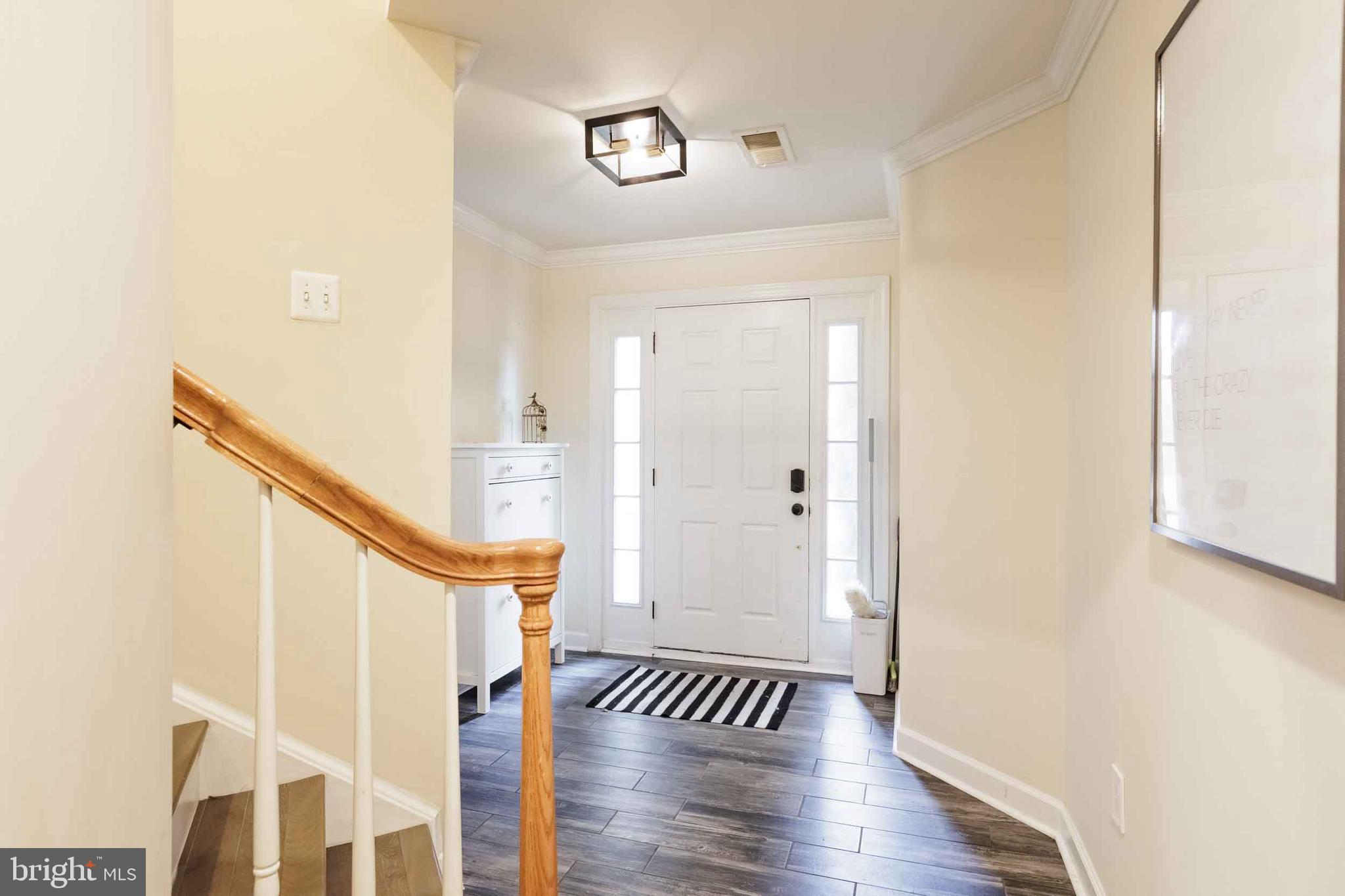 9733 Braidwood Terrace Frederick, MD 21704 - Photo 4 of 33 a view of entryway with wooden floor