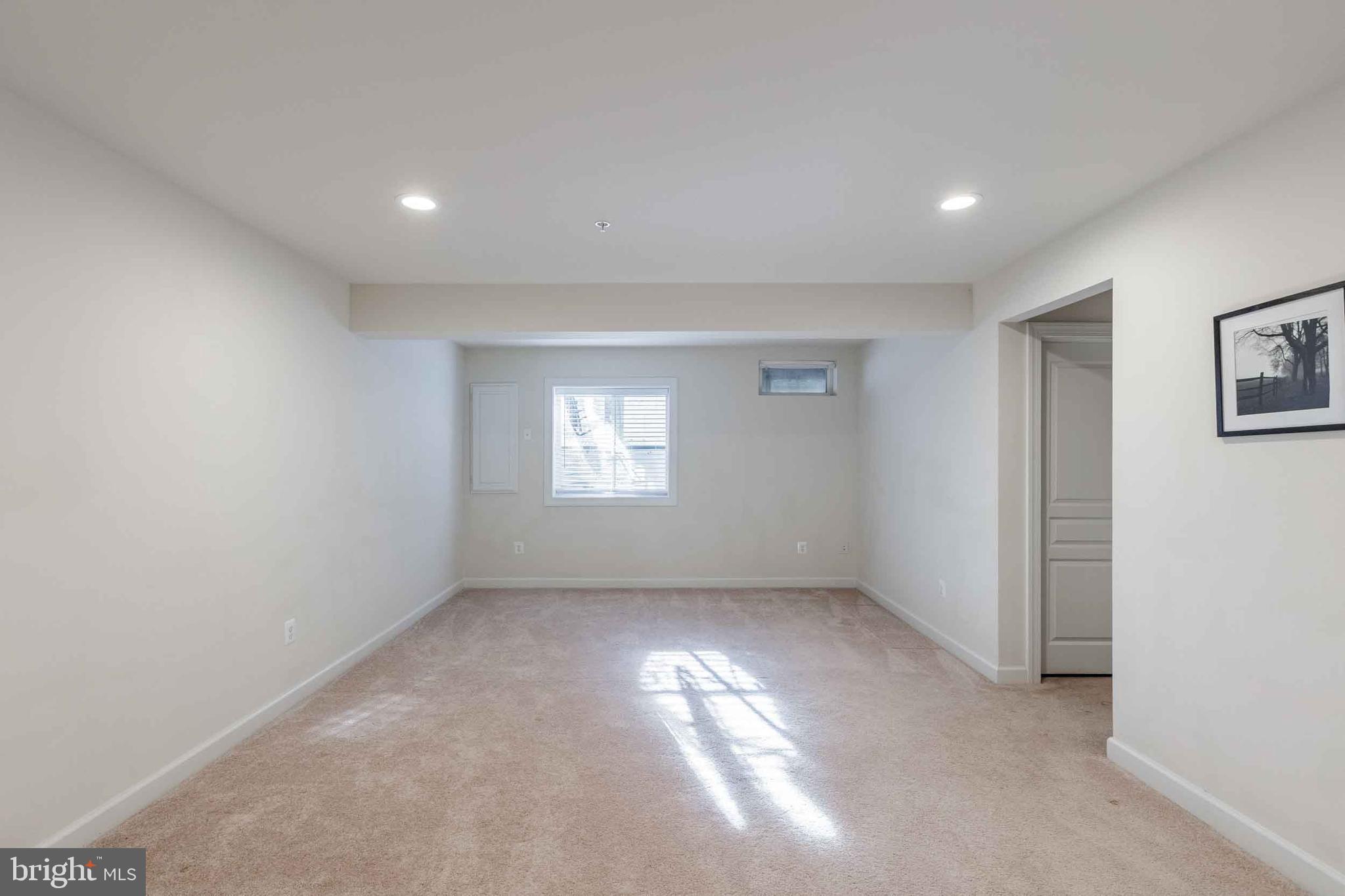 9733 Braidwood Terrace Frederick, MD 21704 - Photo 5 of 33 an empty room with windows