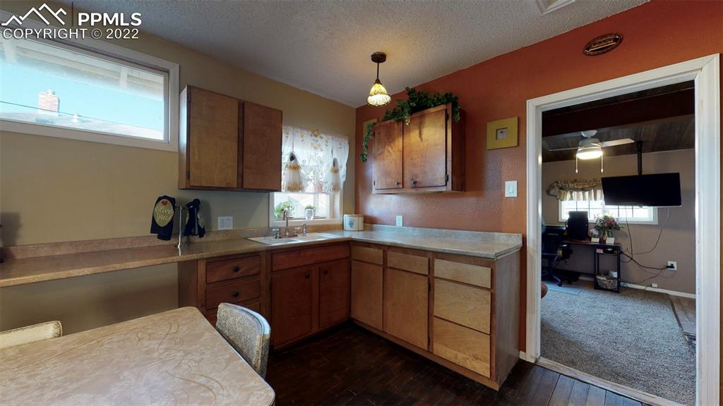 211 West 3rd Street Walsenburg, CO 81089 - Photo 12 of 33 a kitchen with a sink and cabinets