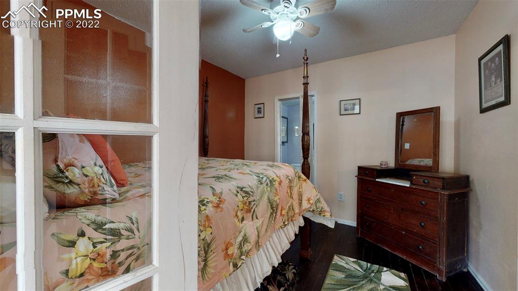 211 West 3rd Street Walsenburg, CO 81089 - Photo 20 of 33 a bedroom with a bed and a dresser