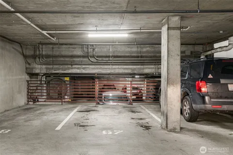 a view of parking garage with cars