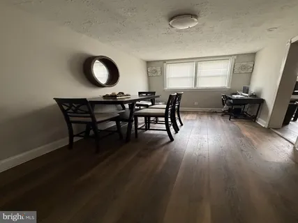 a view of a livingroom with furniture and a window