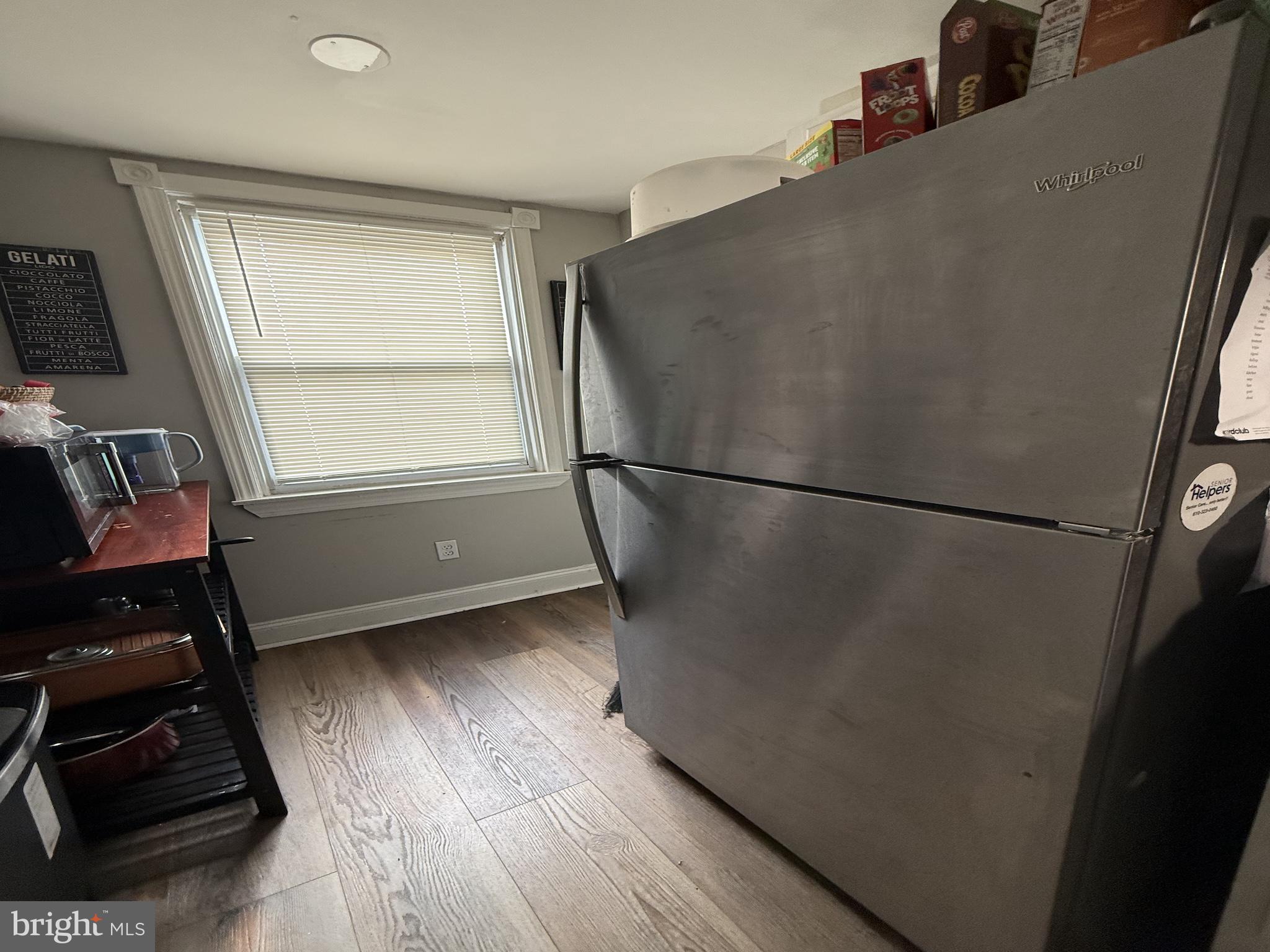 229 West 22nd Street Chester, PA 19013 - Photo 5 of 18 a view of a hardwood floor and a window in an empty room