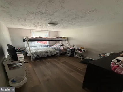 a bedroom with bed and window