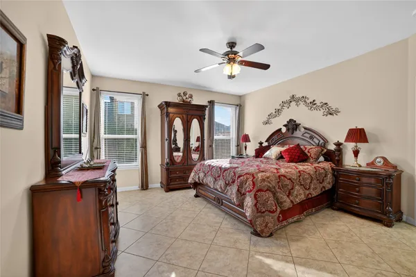 a front view of a house with swimming pool having outdoor seating