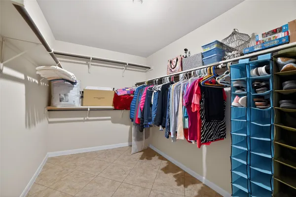 a spacious bathroom with a granite countertop tub sink and mirror