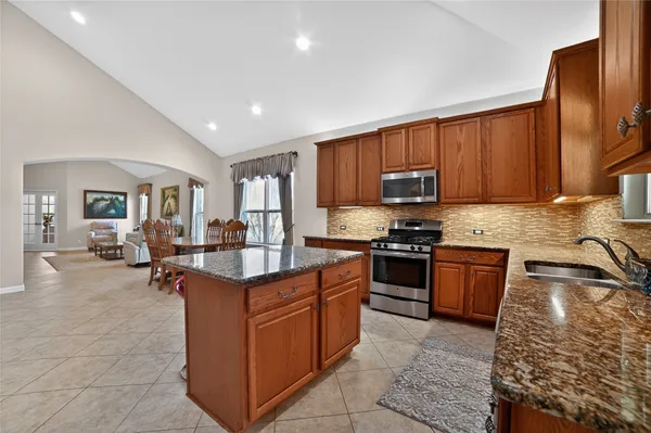 a view of a room with entryway and windows