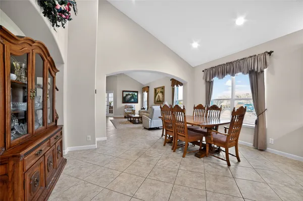 a kitchen with stainless steel appliances granite countertop a stove refrigerator and a sink