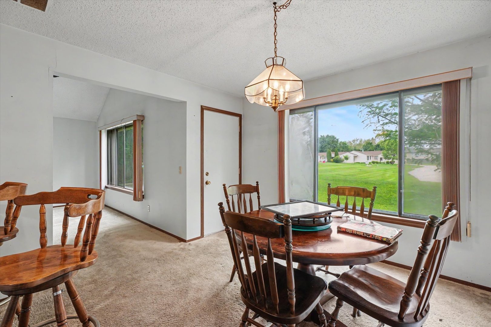 711 Higgins Road Champaign, IL 61822 - Photo 14 of 23 a view of a dining room with furniture window and outside view