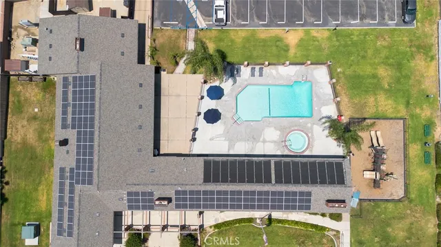 an aerial view of a house with a swimming pool