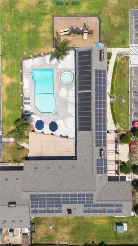 a view of swimming pool with outdoor seating space