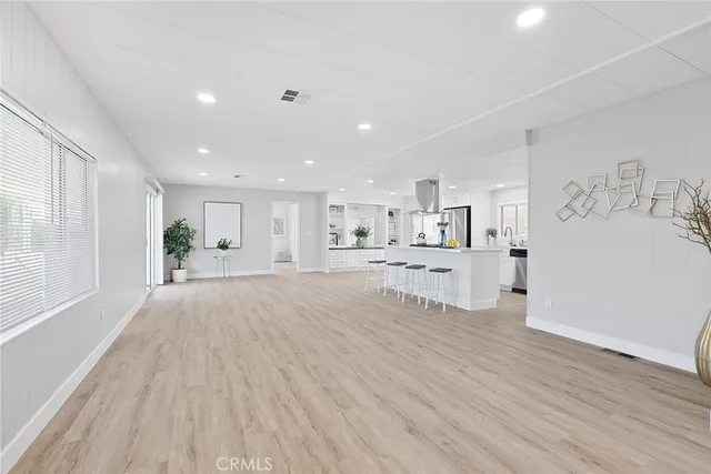 a view of kitchen with wooden floor and window