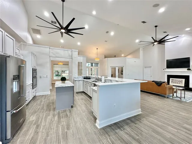 a dining room with furniture window and wooden floor