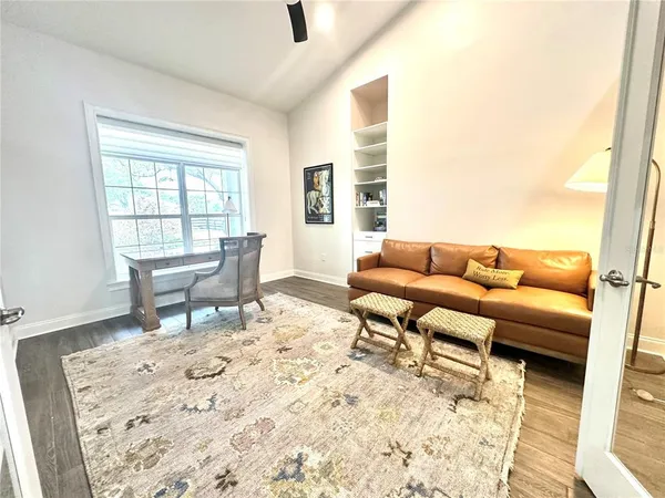 a living room with furniture and a rug